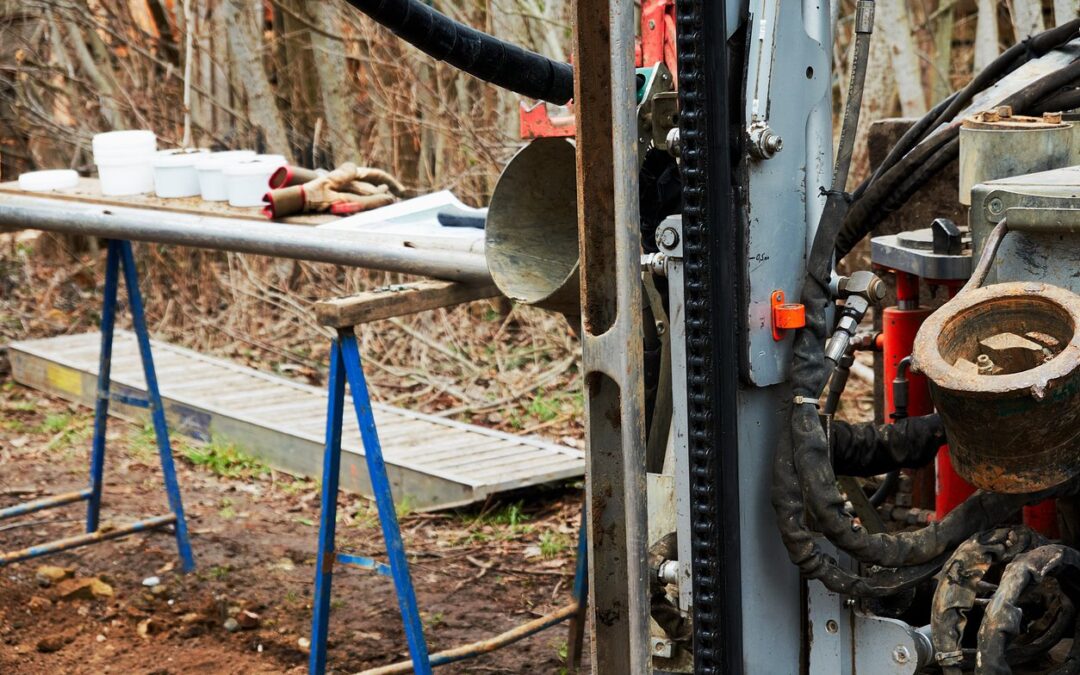Drill rig and soil probe set up for soil sampling in mining industry site